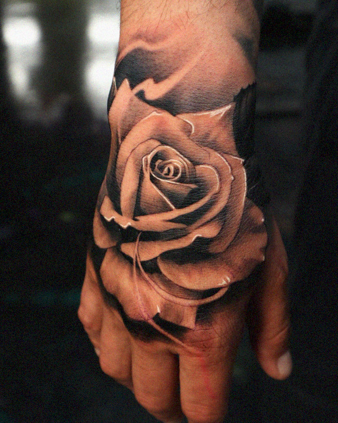 Realistic Rose Tattoo Adorning Hand
