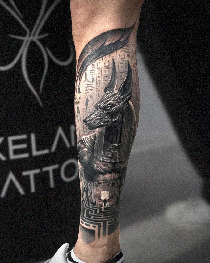 Anubis and Hieroglyphs: Inked Leg Artistry