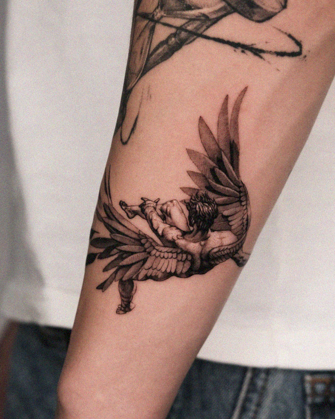 Seraphim Inked: An Angelic Arm Tattoo