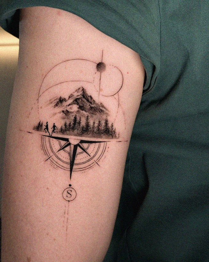 Guided by Mountains Tattooed Arm