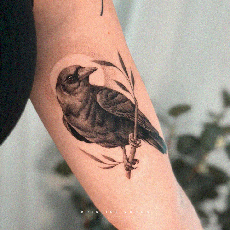 Bird Perch Tattoo: Striking Arm Artwork