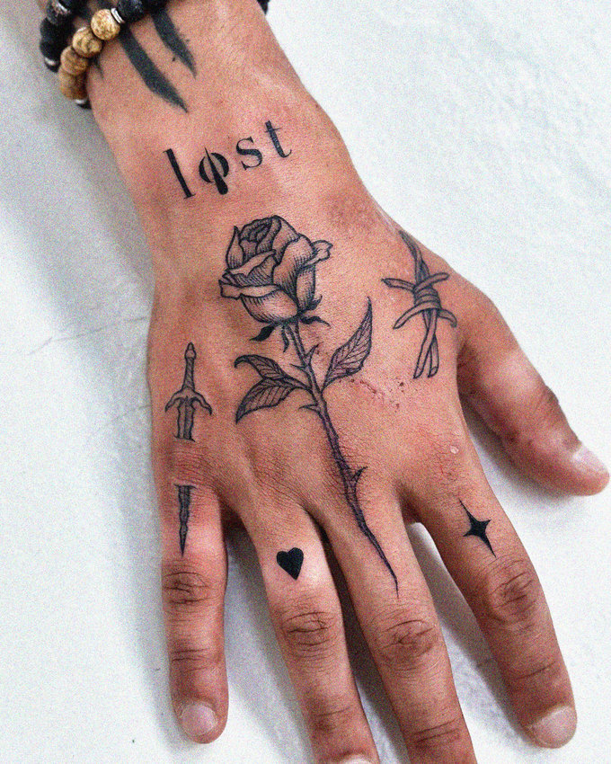 Lost Among Tattoos of Roses and Symbols