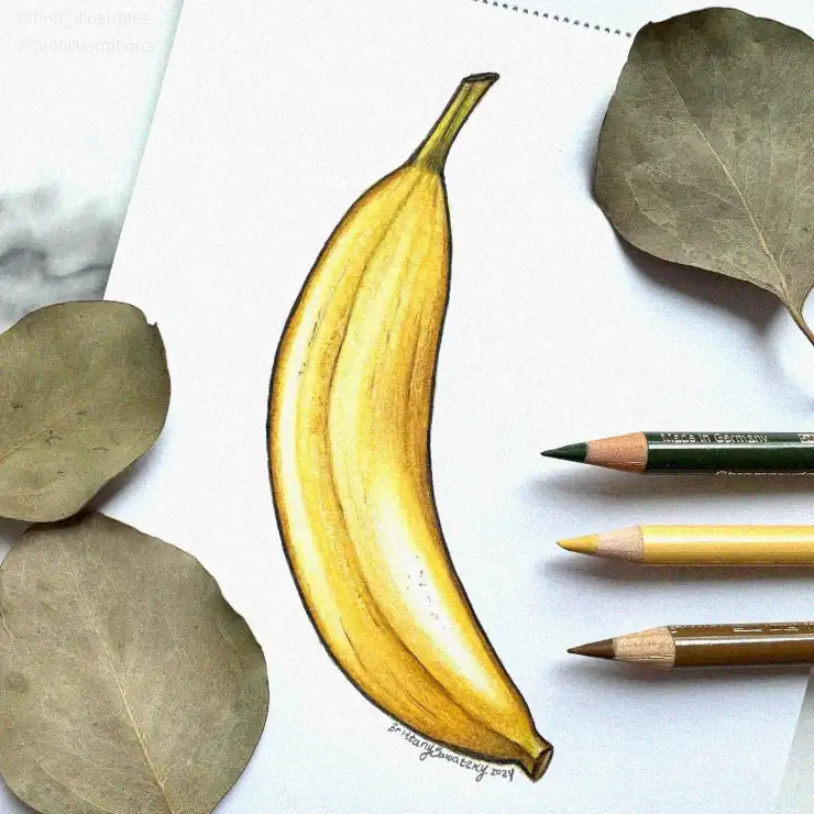 Banana Sketch Amidst Pencils and Leaves