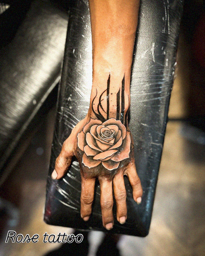 Rose Tattoo Embracing Hand and Forearm