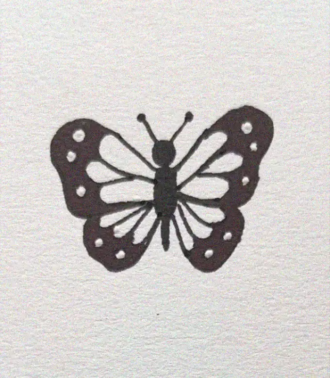 Butterfly Silhouette Against Gray Textures