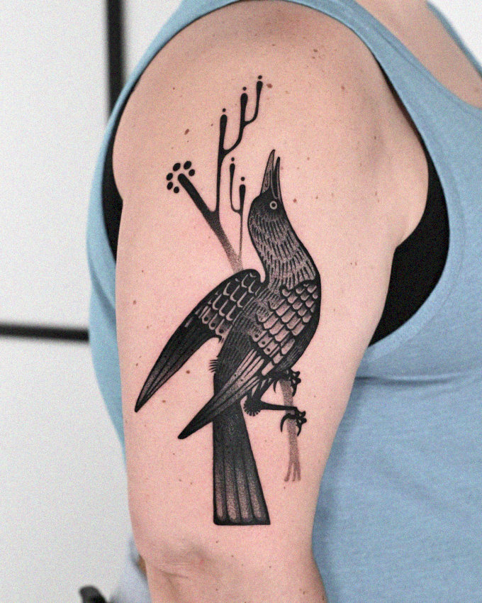 Perched Bird Tattoo in Monochrome Elegance