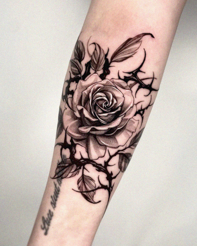 Arm Adorned with Shaded Rose Tattoo