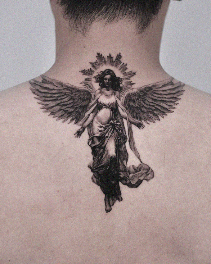 Angel Tattoo Radiates Grace on Back