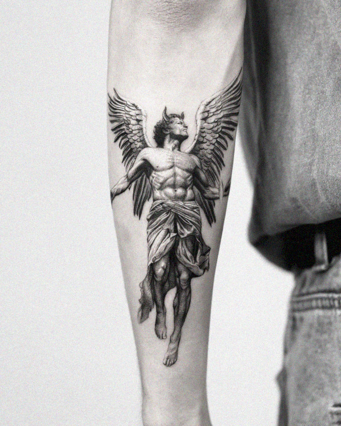 Monochrome Angel Tattoo Embracing the Leg
