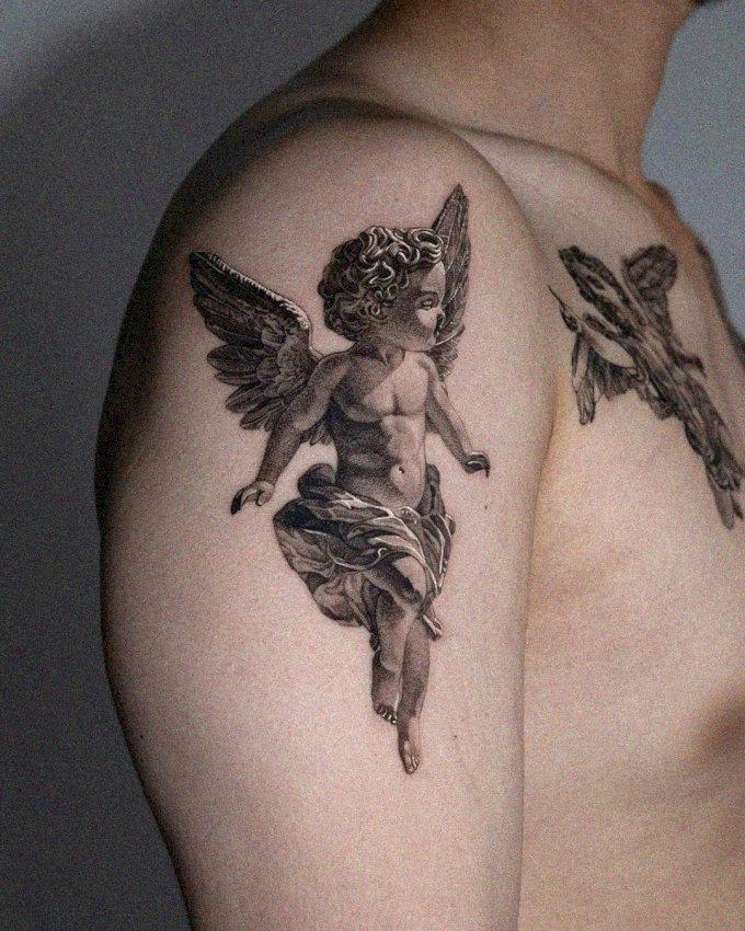 Angelic Figure Tattoo on Upper Arm