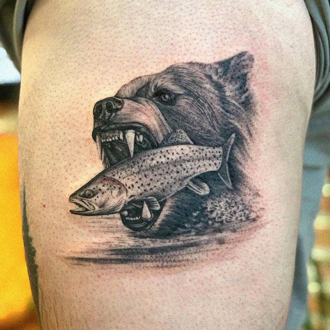 Bear Tattoo Devouring Fish on Arm