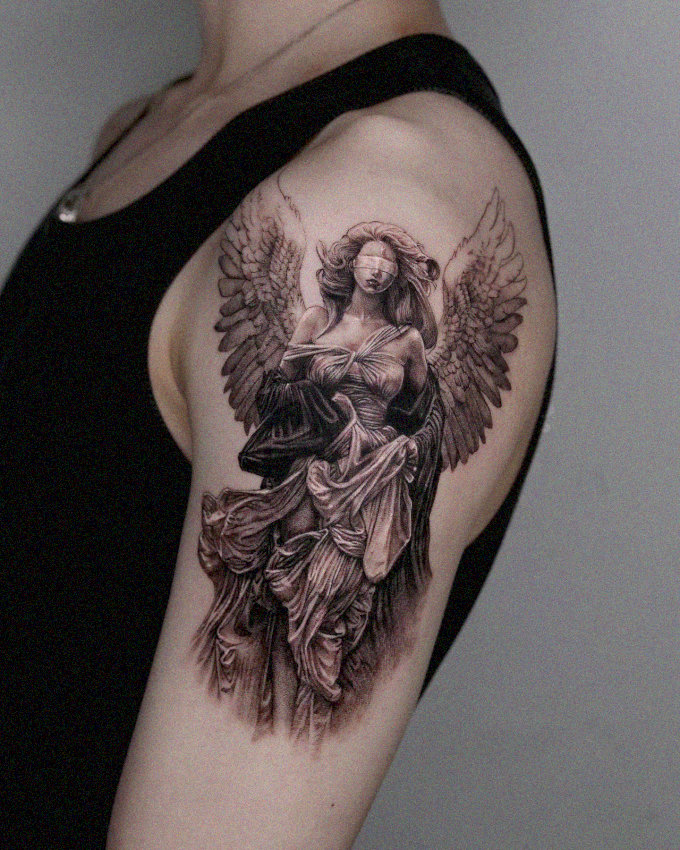 Angelic Figure Tattoo in Vibrant Ink