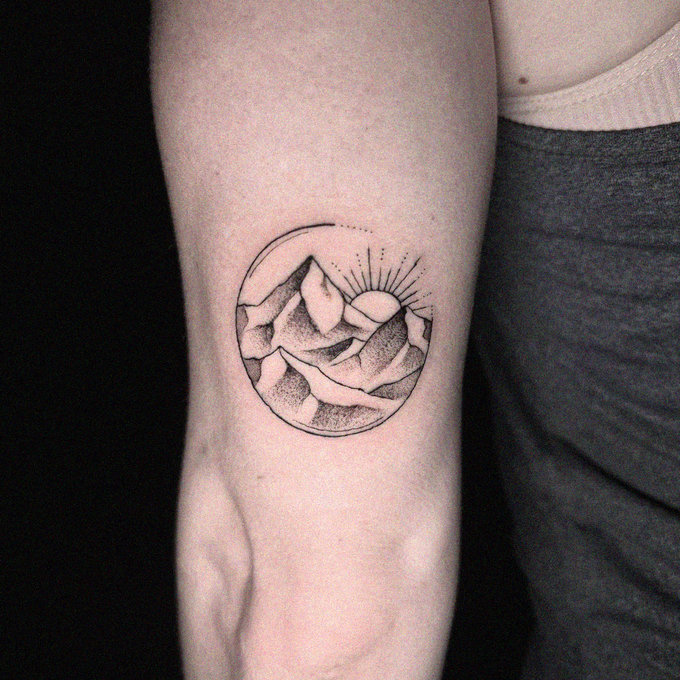 Sunlit Mountain Peaks Tattoo Elegance