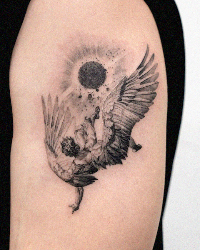 Arm Tattoo of Soaring Bird and Speckled Sun