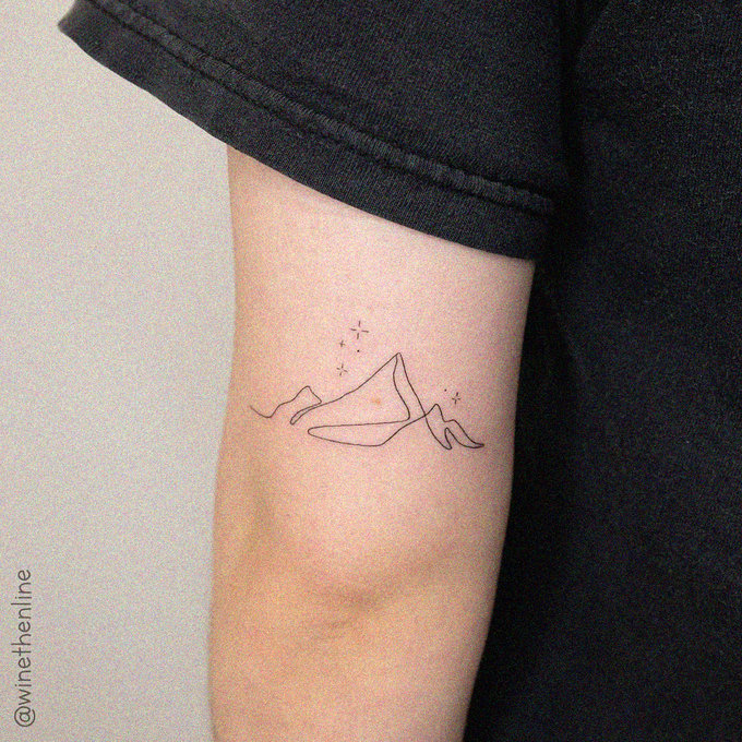 Minimalistic Mountain Tattoo on Arm's Canvas