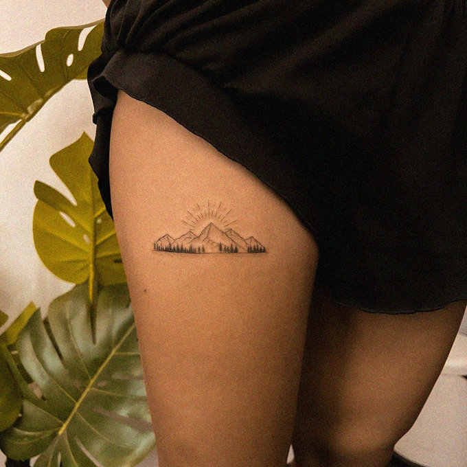 Mountain Tattoo Amidst Verdant Foliage